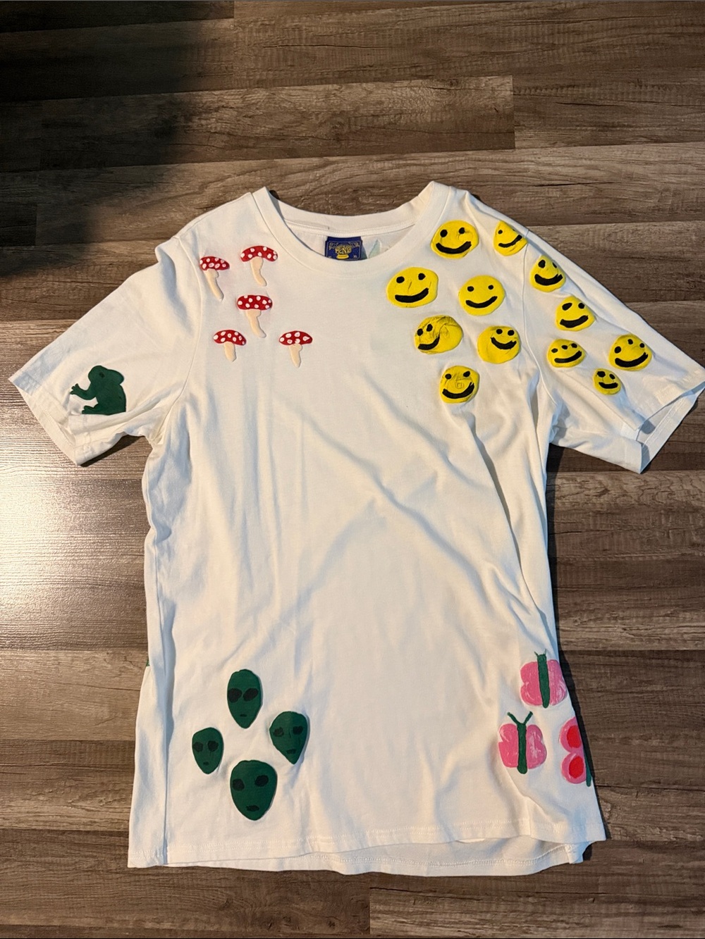 Coney Island Picnic White Graphic Tee with Yellow Smileys and Colorful Icons